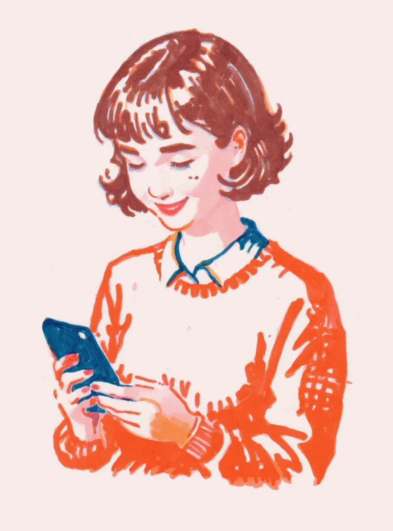 A girl looking at, and enjoying her phone